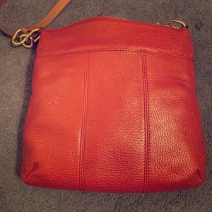 Red crossbody purse with brown strap